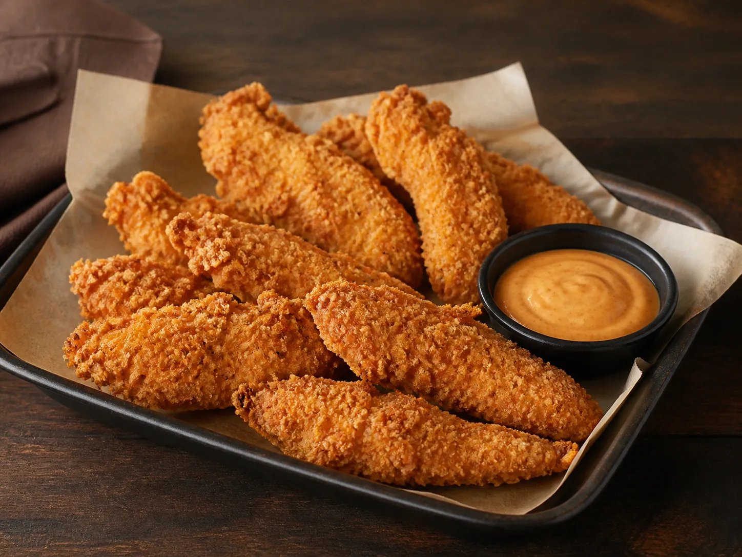 Crispy crumbed chicken strips with dipping sauce